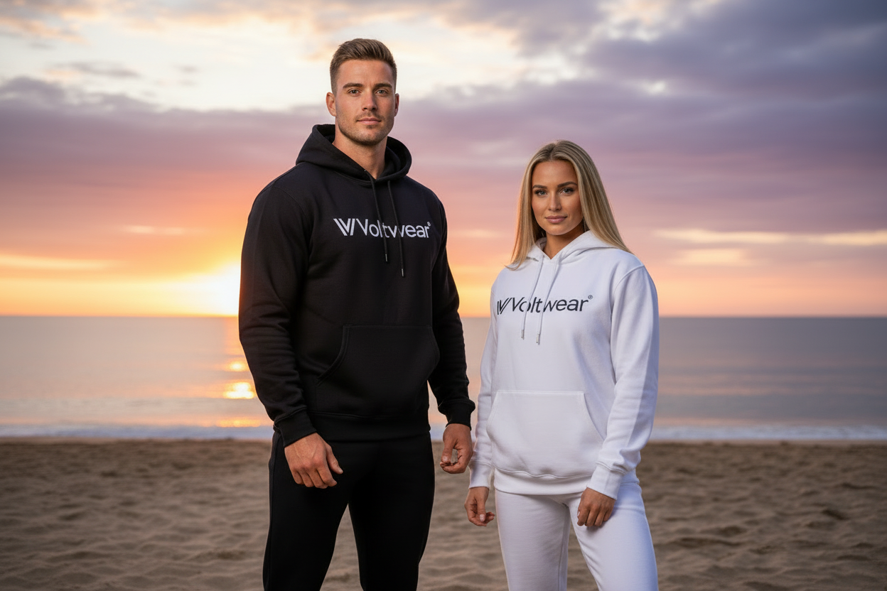 Voltwear models in hoodies and sweatpants on beach